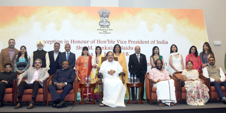 The Vice President, Shri M. Venkaiah Naidu with a group of people, at the Community Reception, in Lima, Peru on May 11, 2018. The Minister of State for Tribal Affairs, Shri Jaswantsinh Sumanbhai Bhabhor and other dignitaries are also seen.