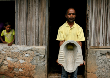 Father and local toilet salesman, Antonia dos Santos in his home village of Lisadila. Antonia creates concrete toilets with the use of a mould and sells them at the market place in Maubara

WaterAid