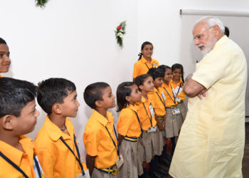 The Prime Minister, Shri Narendra Modi interacting with the school children, at the inauguration of the Integrated Command & Control Centre, at Naya Raipur, Chhattisgarh on June 14, 2018.
	The Chief Minister of Chhattisgarh, Dr. Raman Singh is also seen.