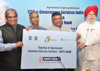 The Union Minister for Electronics & Information Technology and Law & Justice, Mr.Ravi Shankar Prasad and the Minister of State for Electronics & Information Technology, Mr.S.S. Ahluwalia at the signing ceremony of the agreement between HDFC and CSC e-Governance Service India Limited for enabling CSC VLEs all over the country to work as Banking Correspondents, in New Delhi on July 04, 2018.