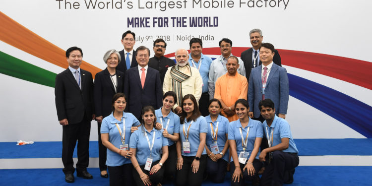 The Prime Minister  Narendra Modi and the President of the Republic of Korea, Mr. Moon Jae-in in a group photograph at the inauguration of the Samsung manufacturing plant, Worlds Largest Mobile Factory, in Noida, Uttar Pradesh on July 09, 2018. The Chief Minister of Uttar Pradesh, Yogi Adityanath and other dignitaries are also seen.