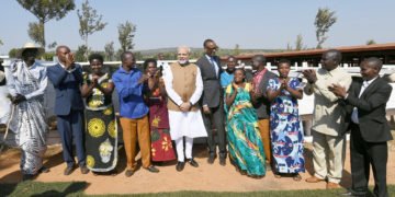 The Prime Minister,  Narendra Modi participating in the Girinka (one cow per poor family programme), during his visit to Rweru Model village, in Rwanda on July 24, 2018.
The President of Rwanda, Mr. Paul Kagame is also seen.