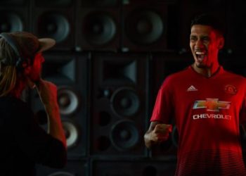 Manchester United defender, Chris Smalling, celebrates in front of a wall of speakers during a Chivas film shoot in July in Los Angeles, United States. The film was released to announce Chivas as the "Official Global Spirits Partner" of Manchester United. Photographer: Monroe Alvarez