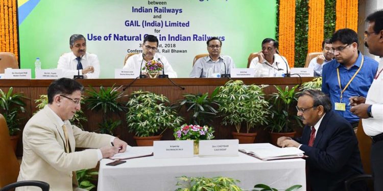 The Chairman, Railway Board, Ashwani Lohani and the CMD, GAIL, B.C. Tripathi witnessing the signing ceremony of an MoU between Ministry of Railways and GAIL for the use of Natural Gas in Railway Workshop & Production Units of Railway, in New Delhi on August 30, 2018.