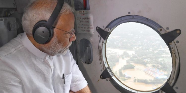 The Prime Minister, Narendra Modi conducting an aerial survey of flood affected areas, in Kerala on August 18, 2018.