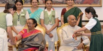 The President, Ram Nath Kovind being tied a Rakhi by a student, on the occasion of Raksha Bandhan, at Rashtrapati Bhavan, in New Delhi on August 26, 2018.