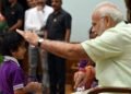 Children tying ‘Rakhi’ on the Prime Minister,  Narendra Modi’s wrist, on the occasion of ‘Raksha Bandhan’, in New Delhi on August 26, 2018.