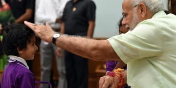 Children tying ‘Rakhi’ on the Prime Minister,  Narendra Modi’s wrist, on the occasion of ‘Raksha Bandhan’, in New Delhi on August 26, 2018.