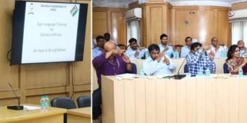 Sign Language Expert interacting with ECI officials while they practise
fingerspelling alphabets