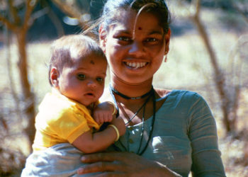 A mother in India holds her infant. Photo: PATH/Richard Franco.