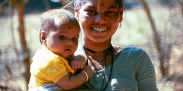 A mother in India holds her infant. Photo: PATH/Richard Franco.