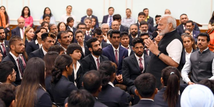 The Prime Minister, Narendra Modi interacting with the Medal Winners of the Asian Games-2018, in New Delhi on September 05, 2018. The Minister of State for Youth Affairs & Sports and Information & Broadcasting (I/C), Col. Rajyavardhan Singh Rathore is also seen.