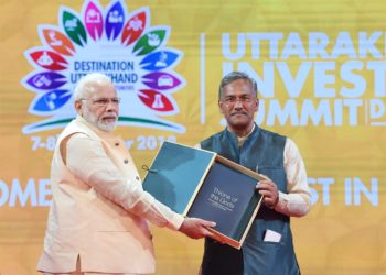 The Prime Minister,  Narendra Modi at the 1st Uttarakhand Investors Summit, at Dehradun, Uttarakhand on October 07, 2018. The Chief Minister of Uttarakhand, Trivendra Singh Rawat is also seen.