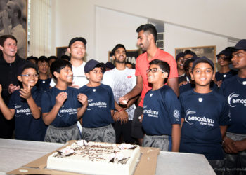 Ball boys cutting a cake to mark the children’s day. ATP professionals Sumit and Prajnesh can be seen sharing the joy. Pic credit: Deepthi Indukuri