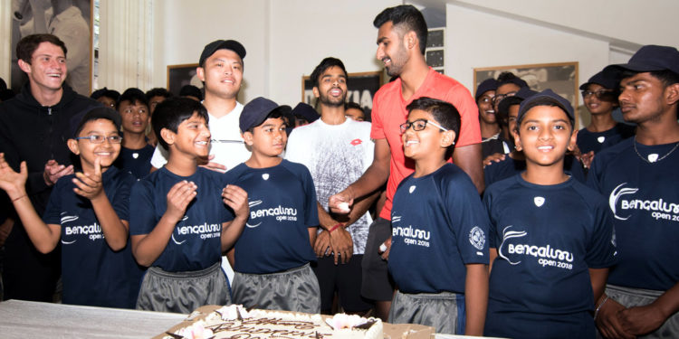 Ball boys cutting a cake to mark the children’s day. ATP professionals Sumit and Prajnesh can be seen sharing the joy. Pic credit: Deepthi Indukuri