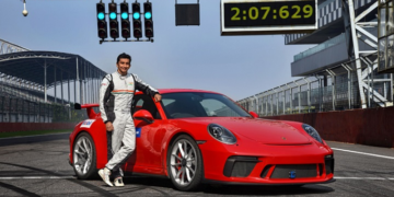 Narain Karthikeyan, India's first Formula 1 Driver, with the Porsche 911 GT3 after setting the lap time record at Buddh International Circuit
