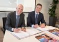 rnst Kuipers, Chairman of the Board of Erasmus University Medical Center (left) and Henk Valk, General Manager Philips Benelux (right) sign long term strategic partnership for hospital-wide ultrasound.