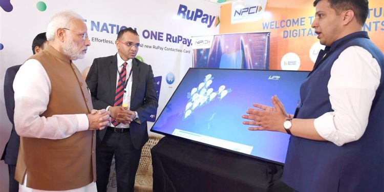 The Prime Minister,  Narendra Modi visiting an exhibition stalls, at the launch of the Support and Outreach Initiative for MSMEs, in New Delhi on November 02, 2018.