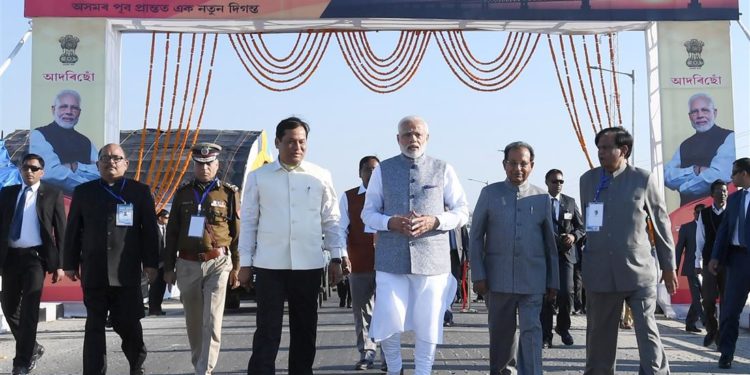 The Prime Minister, Narendra Modi at the dedication of the India’s longest Bogibeel Bridge to the nation, at Dibrugarh, Assam on December 25, 2018. The Governor of Assam, Jagdish Mukhi and the Chief Minister of Assam, Sarbananda Sonowal are also seen.