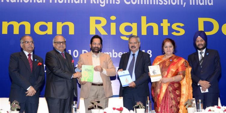 The Union Minister for Minority Affairs, Mukhtar Abbas Naqvi releasing the publications at the Human Rights Day function, organised by the National Human Rights Commission, in New Delhi on December 10, 2018. The Chairperson of National Human Rights Commission Justice H.L. Dattu and other dignitaries are also seen.