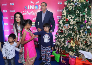 Smt.Amruta Fadnavis with Mr.Alok Tandon, CEO, INOX, celebrating Christmas with special kids at METRO INOX