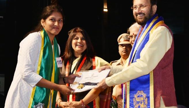 The Union Minister for Human Resource Development, Prakash Javadekar giving away the degrees to the students at the 31st Convocation of Goa University, in Goa on December 15, 2018. The Vice Chancellor, Prof. Varun Sahani is also seen.