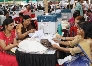 Polling officials collecting the Electronic Voting Machine (EVMs) and other necessary inputs required for the General Elections-2019, at the distribution centre, in Indore, Madhya Pradesh on May 18, 2019.