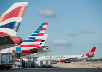 Heathrow, airfield, aircraft tail fins on apron, Sep 2018.