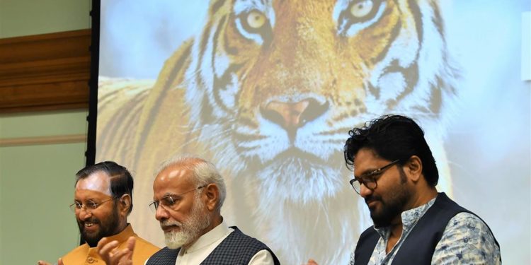 The Prime Minister,  Narendra Modi at the release of the results of 4th cycle of All India Tiger Estimation – 2018, on the occasion of the Global Tiger Day, in New Delhi on July 29, 2019. The Union Minister for Environment, Forest & Climate Change and Information & Broadcasting, Prakash Javadekar and the Minister of State for Environment, Forest and Climate Change, Babul Supriyo are also seen.