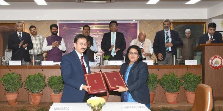 The Minister of State for Railways, Suresh Angadi and the Minister of Tourism, Karnataka, C.T. Ravi witnessing the signing ceremony of a Memorandum of Understanding (MoU) between Indian Railways Catering & Tourism Corporation (IRCTC) & Karnataka State Tourism Development Corporation (KSTDC), in New Delhi on November 19, 2019. The Chairman, Railway Board, Vinod Kumar Yadav and other dignitaries are also seen.