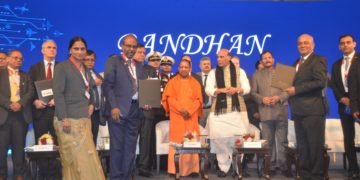 Mr Gowtama M V, CMD, BEL, Mr Sujit, Baksi, Head APAC Business and President Corporate Affairs, Tech Mahindra, and Mrs Anandi Ramalingam, Director (Marketing), BEL, pose for a photo with Shri Rajnath Singh, Hon’ble Raksha Mantri, Shri Yogi Adityanath, Hon’ble Chief Minister of Uttar Pradesh, and other dignitaries after signing the MoU.