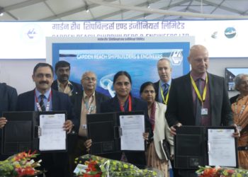 (Left-Right) Cmde S Nayyar (IN Retd), Director (Ship Building), GRSE, Mrs Anandi Ramalingam, Director (Marketing), BEL, and Mr Yaron Levi, Vice President (Naval Systems), Elbit Systems, display the tripartite MoU signed between BEL, GRSE and Elbit Systems.