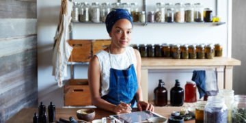 Woman making organic skincare products in her studio