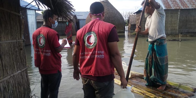 Bangladesh Red Crescent Society volunteers reaching affected communities with drinking water and other support after monsoon floods affected more than one-third of the country.Photo:  COURTESY Bangladesh Red Crescent