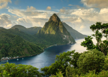 Stunning view of the Pitons (Petit Piton & Gros Piton) from an elevated viewpoint with the rainforest and bay of Soufri?re in the foreground.