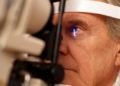 Senior man having eye exam --- Image by © Ocean/Corbis