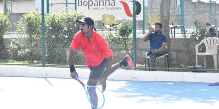 Second Seed Prajwal Dev of Karnataka serves during his semifinal match.