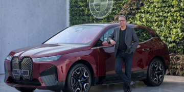 Mr. Vikram Pawah, President, BMW Group India with the BMW iX