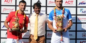 Aleksandar Vukic (right), winner of Bengaluru Open ATP Challenger title along with runner-up Dimitar Kuzmanov (left) with Indian hockey legend Dhanraj Pillay (centre).