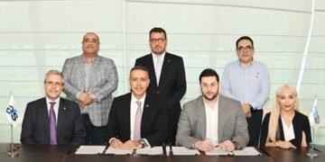 CEOs of Jingle Pay and AFS signing the strategic partnership