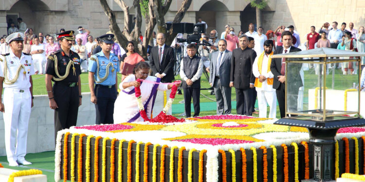 The President, Smt. Droupadi Murmu paying floral tributes at the Samadhi of Mahatma Gandhi on his 153rd birth anniversary, at Rajghat, in Delhi on October 02, 2022.