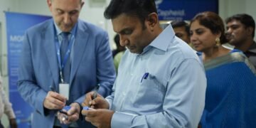 Laurant Bellon, Sr VP global Operations, Cepheid Global along with Dr K Sudhakar, Dr K. Sudhakar, Hon. Minister for Health & Family Welfare and Medical Education, Govt. of Karnataka signing the TB cartridges