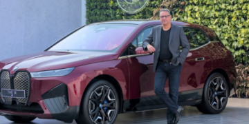 Mr. Vikram Pawah, President, BMW Group India with the BMW iX