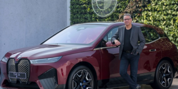 Mr. Vikram Pawah, President, BMW Group India with the BMW iX