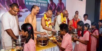 The Akshaya Patra Foundation feeding mid-day meals to students in the newly launched kitchen